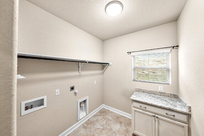 Building Photo - No Rear Neighbors, 3 Car Garage, a Chef's Kitchen, and Room for Everyone