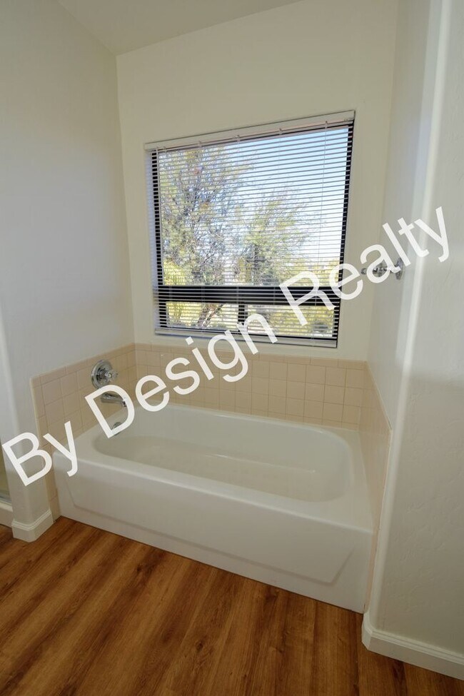 Building Photo - Updated SE Tucson 3BR/2.5BA Gem: Cathedral Ceilings & Private Wash Views