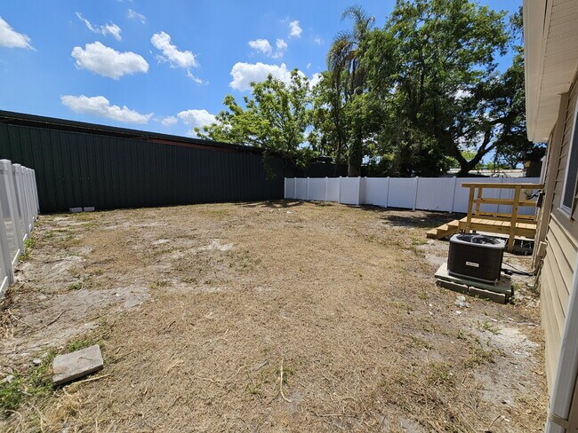 Building Photo - fully renovated 2-bedroom, 1-bathroom home with bonus guest room or office and oversized fenced yard