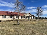 Building Photo - "Charming 3-Bed Oasis on US Highway 87: Sp...