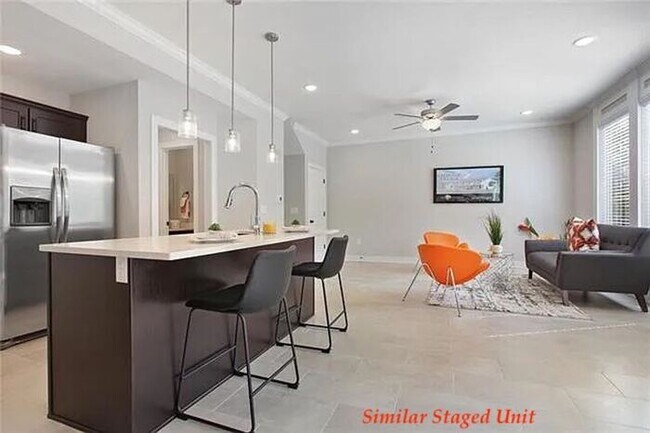 Building Photo - Stunning and Bright 3BR 2.5BA Townhome w/ 2-Car Garage • Quartzite Kitchen • Deck in Parkville