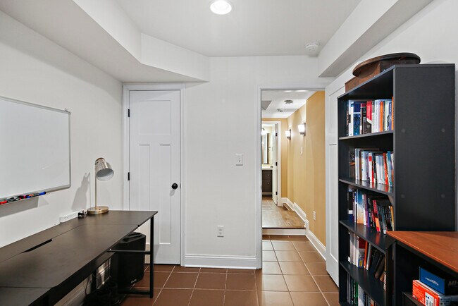 Finished basement with attached bathroom can be used as a third bedroom - 614 S Port St