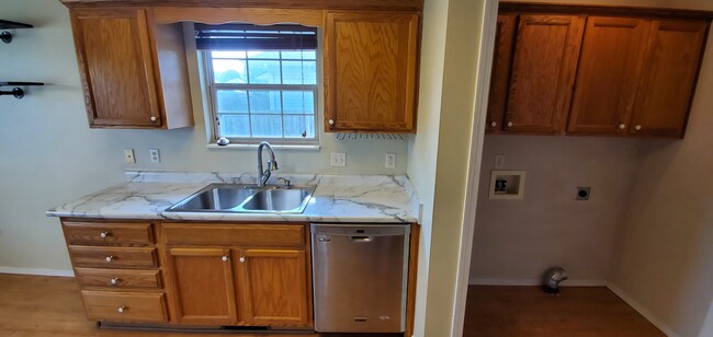 Stainless sink with garbage disposal and stainless Maytag dishwasher included - 4960 W Tarkio St