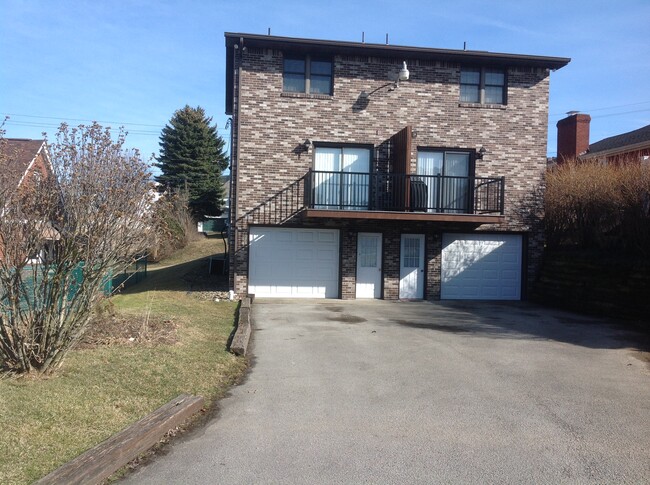 Paved drive, 2nd car, keyless man door entry, remote garage door opener - 503 Lewis Ave