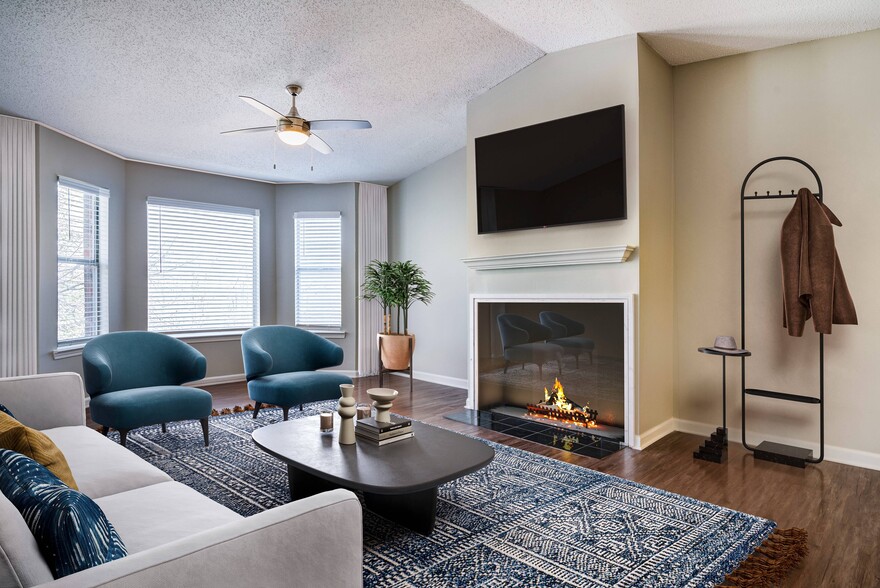 Living area's large windows and fireplace - Avana Bellevue