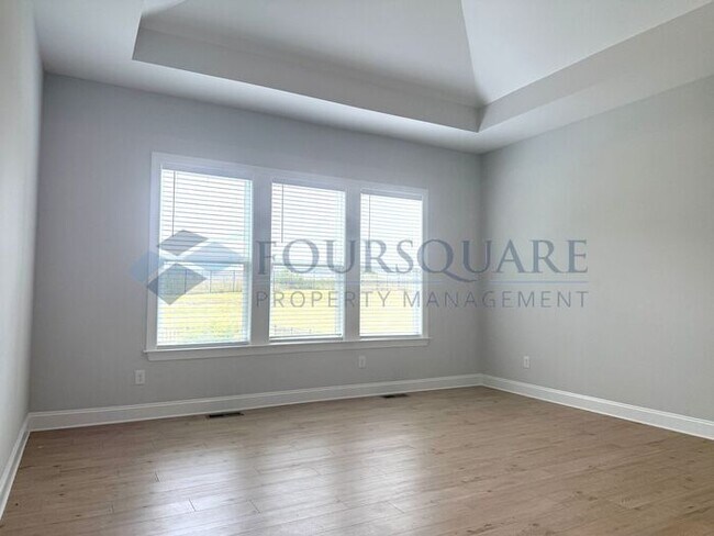 Building Photo - Elegant 4-Bed / 3.5-Bath Home with Main-Level Primary Suite, Quartz Kitchen & 3-Car Garage – In H...