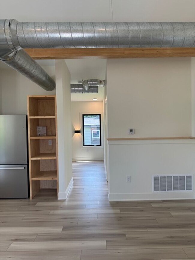 Building Photo - Vaulted Ceilings & Hardwood Floors in This Charming Indianapolis L