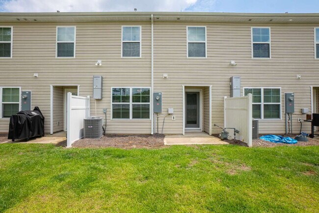 Building Photo - Partially furnished and now available!