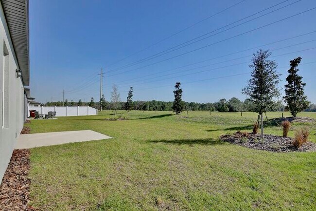 Building Photo - Stylish Sunbrooke Sanctuary! Modern 4/2 Home with High Ceilings, Designer Kitchen & Resort Amenities