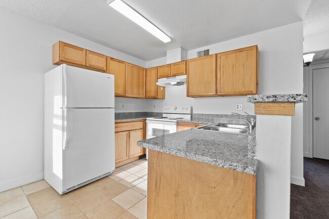 Building Photo - Spacious 2-Bedroom Condo with Fireplace – ...