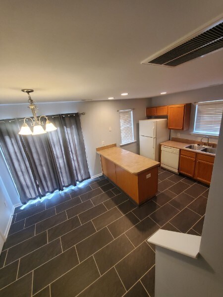 Kitchen with view of dining area - 7802 Averette Field Dr