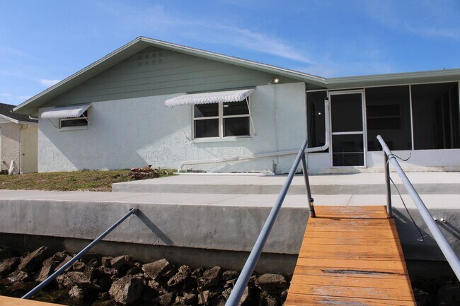 Building Photo - For Rent – 3-Bed / 2.5-Bath Deep Water Canal, Canal-Front Home with a Floating Dock,  totally ren...