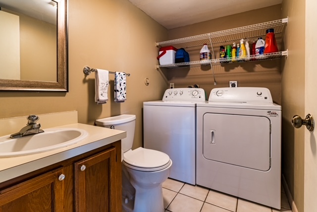 laundry room and 1/2 bath - 5830 SE Windsong Ln