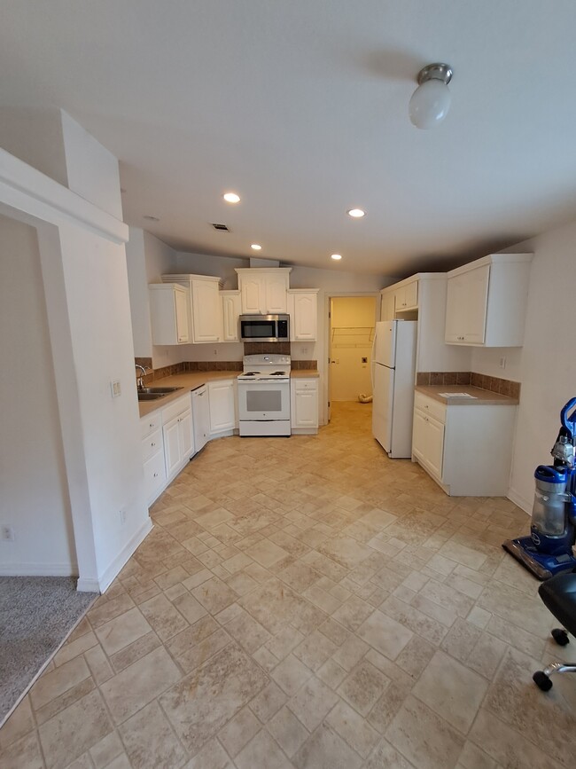 Kitchen with laundry off of - 403 Quail Hollow Rd