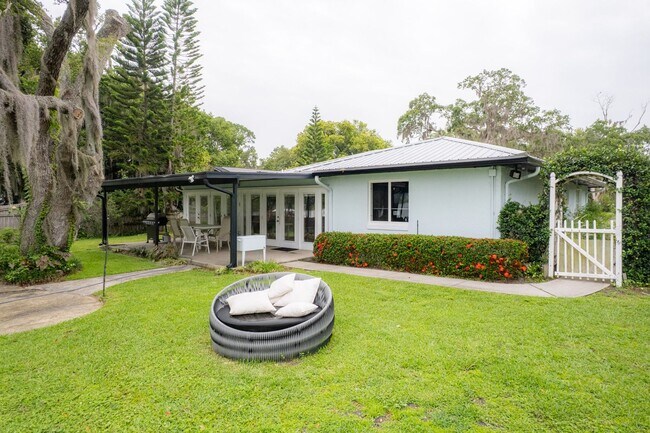 Building Photo - Lake Jessamine Luxury: Solar-Powered Waterfront Retreat on 1.14 Acres with Dock & Boathouse