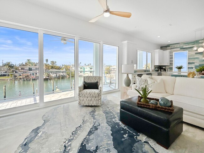 Building Photo - Waterfront Johns Pass Luxury | Steps to Beach + Pool, Hot Tub & Dock