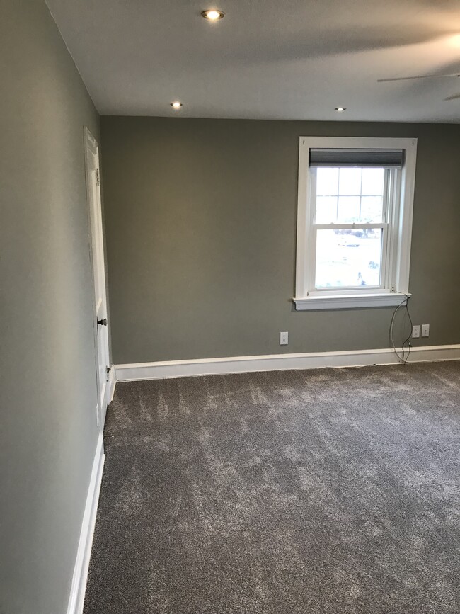 Expansive living area, newly renovated with new carpeting - 430 Main St