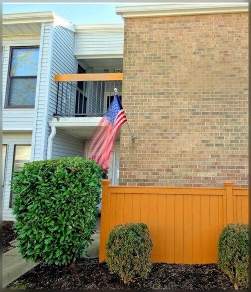 Front view with balcony. - 10L Dennison Dr