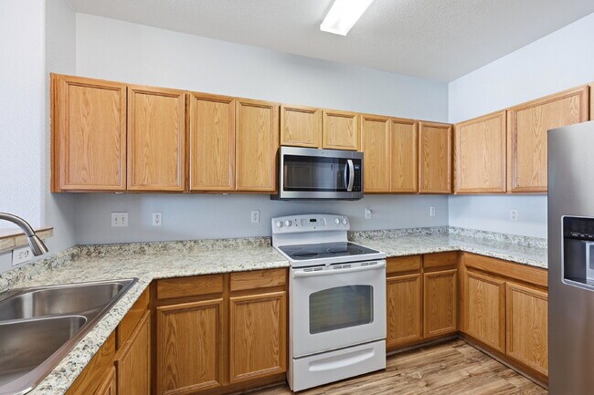 Building Photo - $1,945.95 - 2 Bed, 2.5 Bath Townhome in Colorado Springs with Attached Garage!