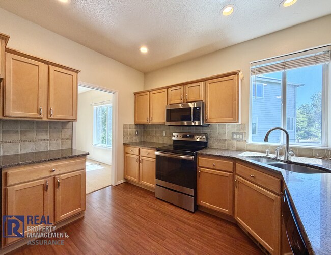 Building Photo - Spacious 4BR/2.5BA Beaverton Home with 3-Car Garage and Covered Deck