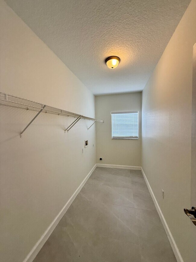 Building Photo - GORGEOUS, Large Completely Renovated Two-Story 4/2.5 PLUS LOFT in POINCIANA VILLAGES!