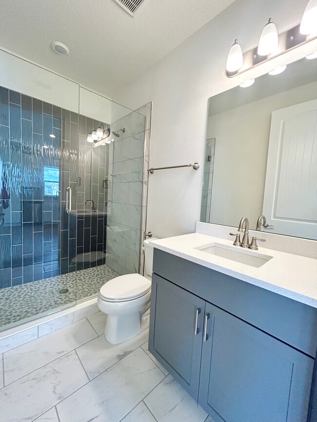 Building Photo - Modern 1/1 Garage Apartment Living in the Heart of Laureate Park!