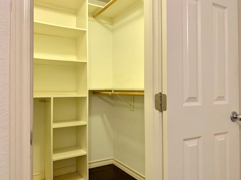 Walk in closet with storage shelves. 1x1 Condo in Hyde Park. 407 E 45th St. Austin. 78751 - 407 E 45th St #116