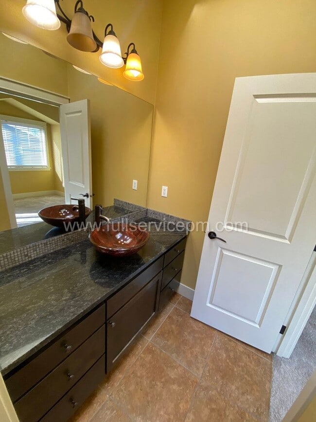 Building Photo - Spacious townhome with private backyard, garage parking, multiple decks, and a dedicated home off...