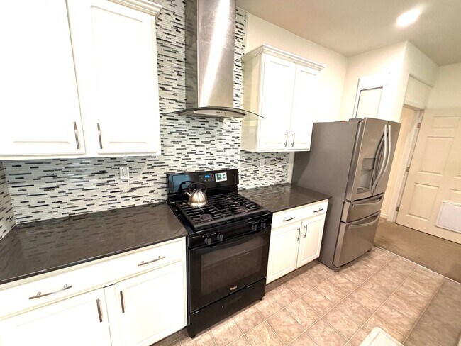 Building Photo - Spacious 5BR + Loft in Hamptons Village – Studio Suite, New HVAC, EV Charging