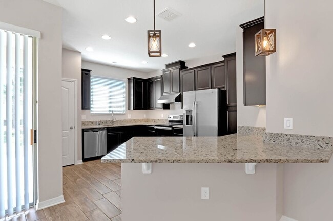 Building Photo - Spacious, Nearly New and Gated 3/2.5/2 Plu...