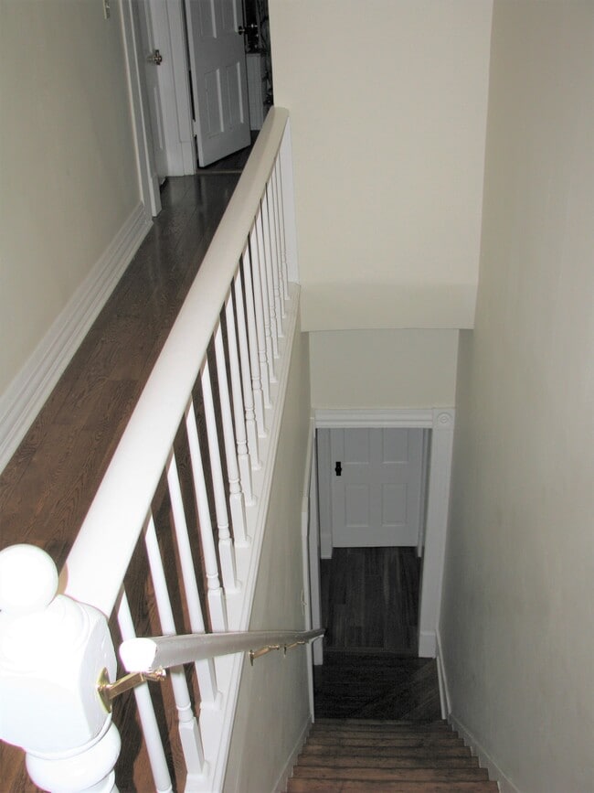 Stairs to upper level - 57 E Russell St