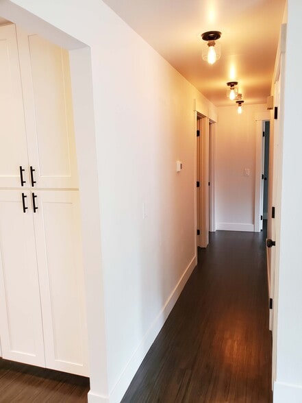 Hallway to 3 bedrooms - 8105 Spur Ct NW