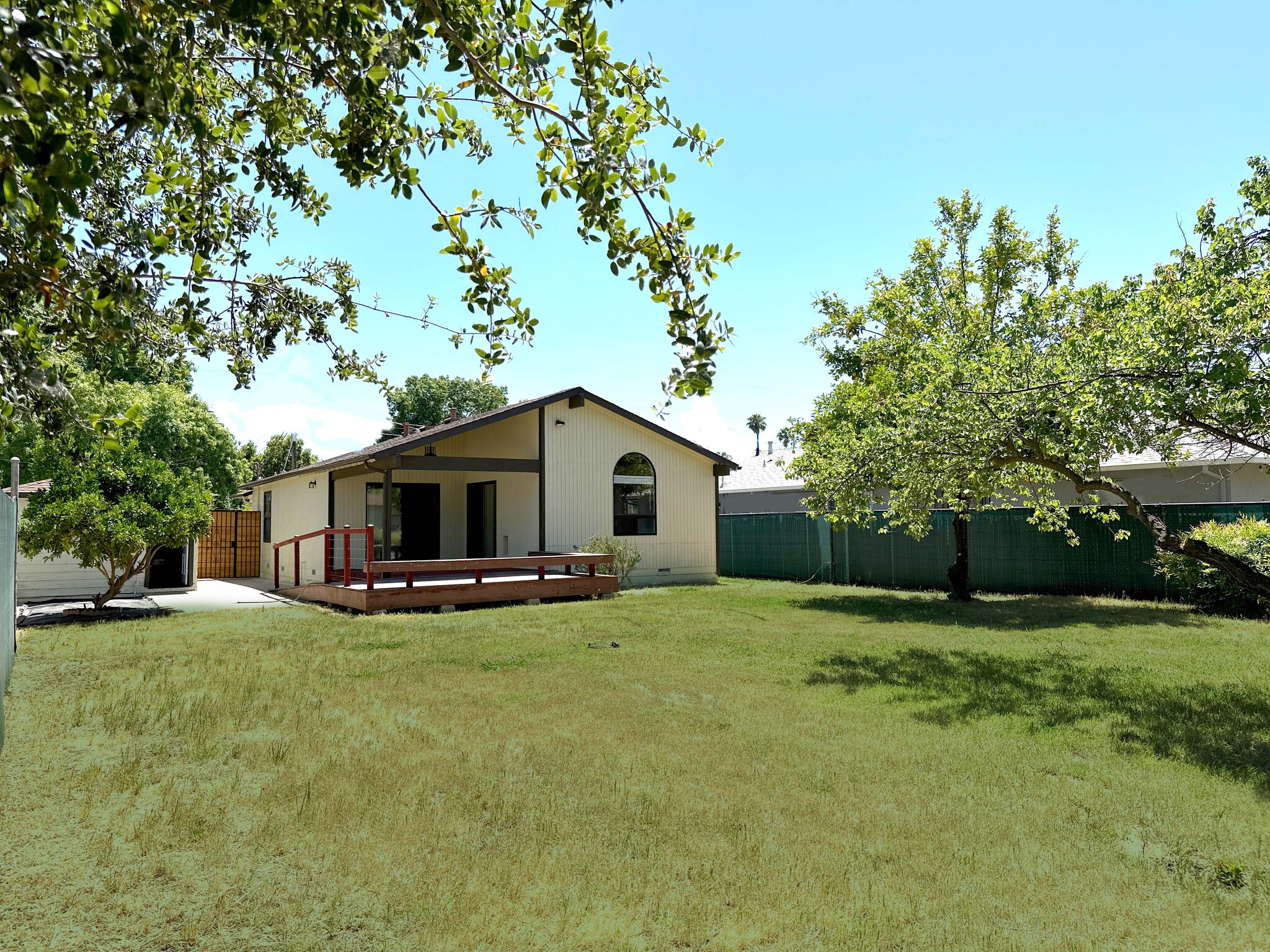 Spacious backyard retreat with mature fruit trees and room to relax or entertain. - 4570 58th St