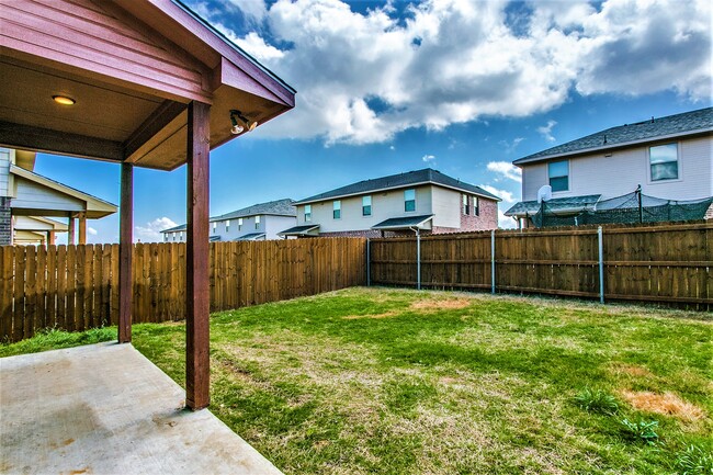 Backyard - porch and cedar fence - 4917 Sanger Circle