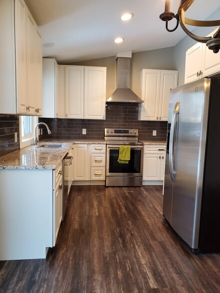 Range hood vented outside for those that love to cook. Convection oven. Tiled back-splash. - 2525 Cedar Hills Drive