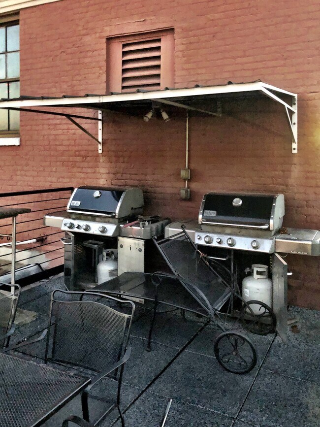Rooftop has grills, tables and seating - 109 N Main St