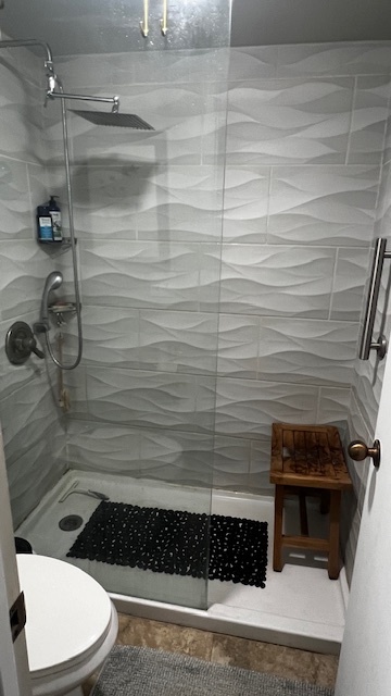 Glass shower with tile walls, rain and spray combo showerheads - 7777 E Main St