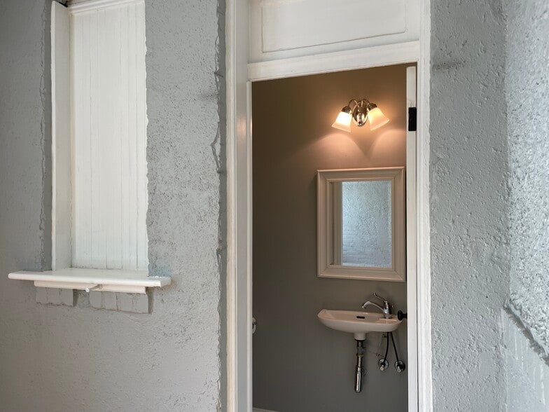 Powder room off of the den on the first floor. - 1110 4th St NE