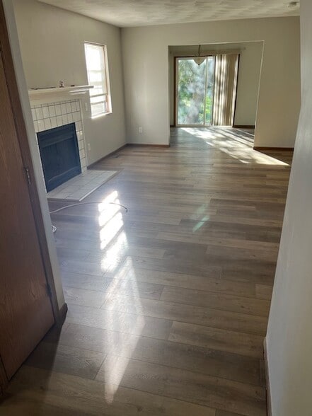 living room with new LVP floors - 7403 Mapleleaf Blvd