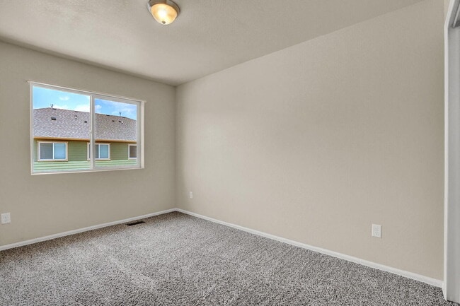 Building Photo - Modern Townhome with Central A/C, 2-Car Ga...