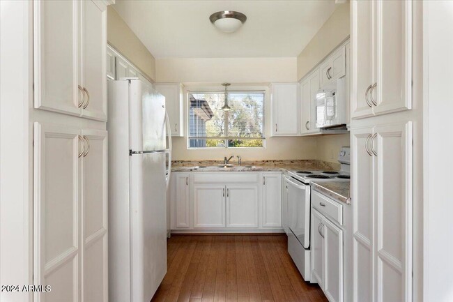 All White Kitchen and Appliances - 6935 E 4th St