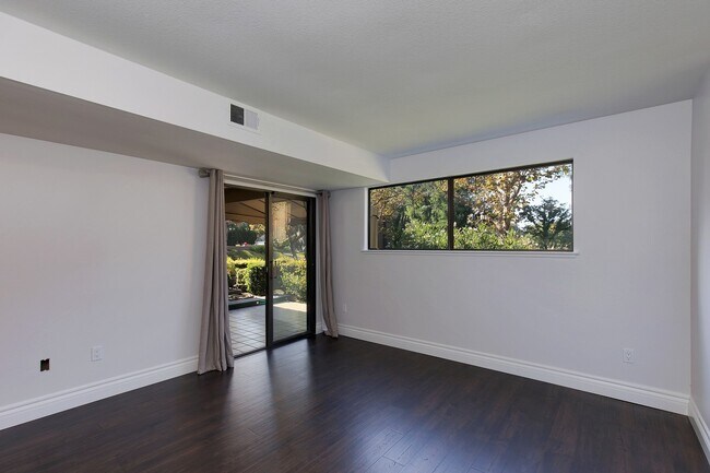 Building Photo - Lake and Golf Course View- Remodeled Condo w/ 2 Car Garage!