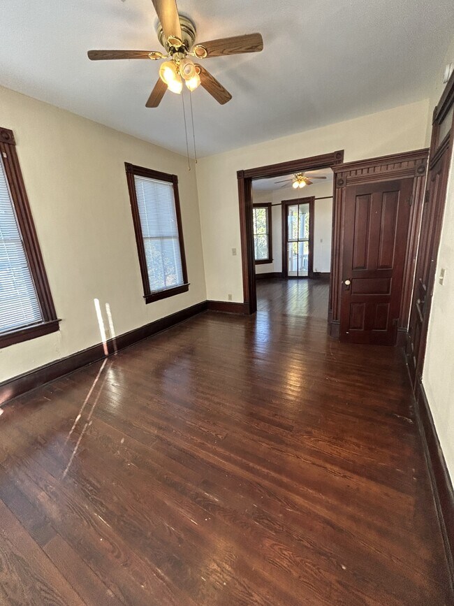 Formal living room looking through pocket doors into the formal dining room - 1118 25th St