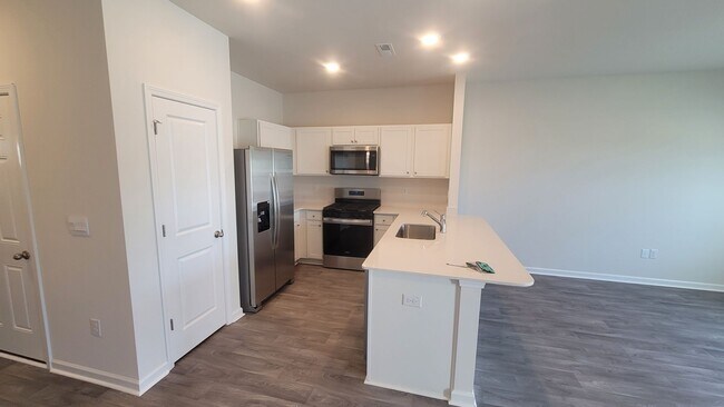 Building Photo - Beautiful New Townhome for Military Tenant