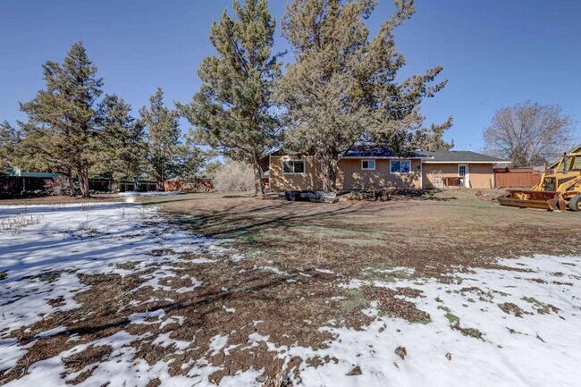 Building Photo - 1/2 acre in the with RV Hook ups