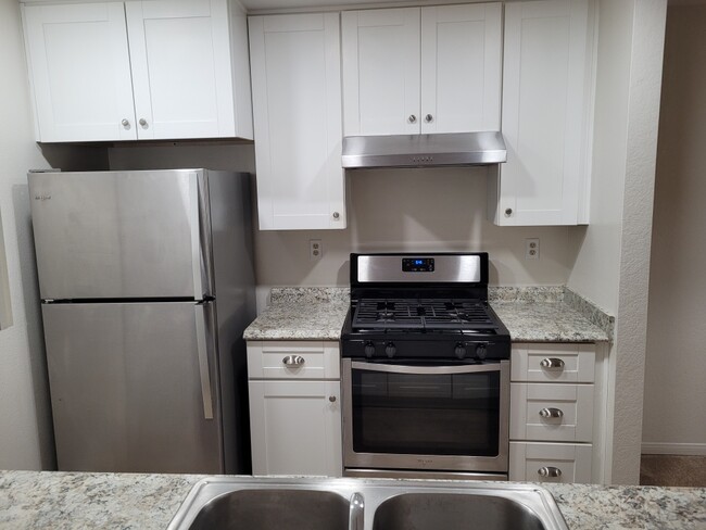 Kitchen - refrigerator, range hood and stove - 2 yrs 4 mths old - 13006 Wimberly Sq