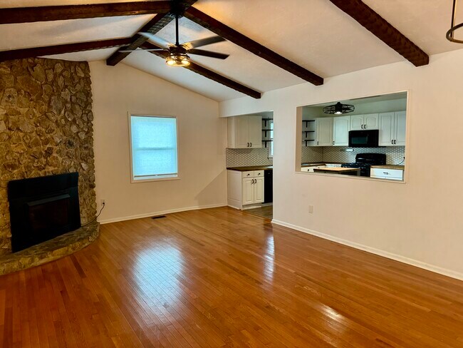 Vaulted ceilings, hardwood flooring and natural light make this space cozy and serene - 6111 Northlakes Dr