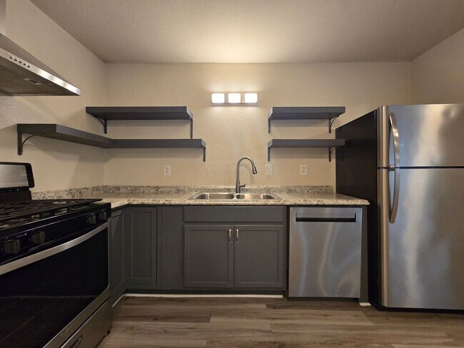 Building Photo - RENT REDUCTION - AVAILABLE NOW!