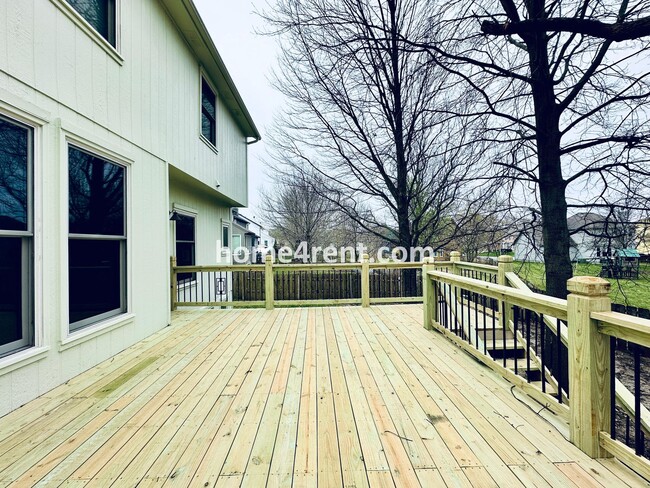 Building Photo - Blue Valley Schools w/ Wood Floors, Finished Basement and a Peaceful, Private Fenced Yard!