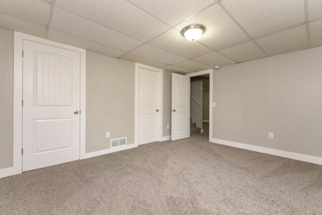 Building Photo - Spacious 3BR Duplex with Finished Basement & 2-Car Garage in Otsego